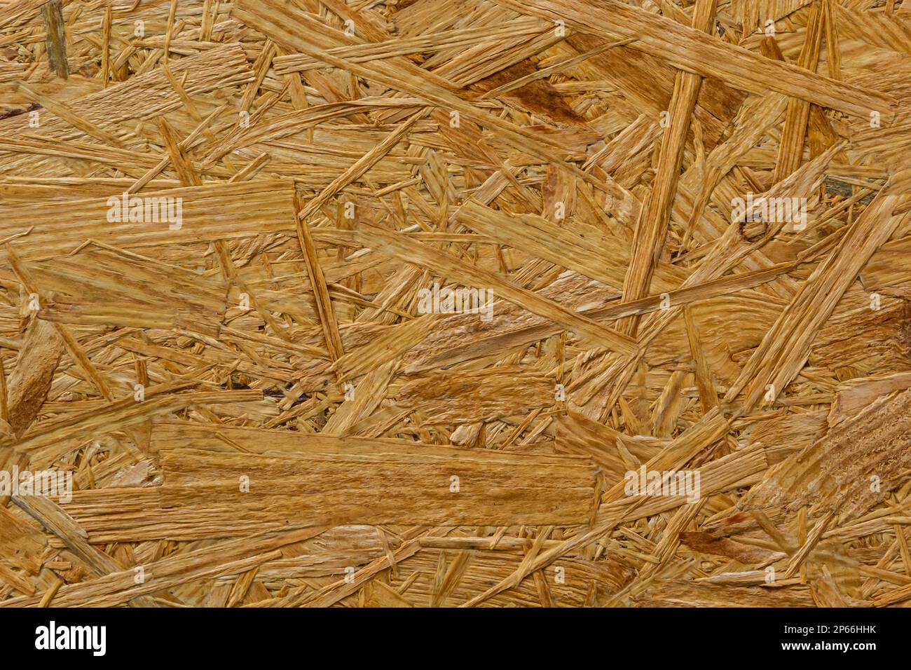 Struktur des OSB-Boards. Brauner Holzhintergrund. Einfaches gepresstes Spanplattenmuster. Braune Holzstruktur. Chip-Board-Hintergrund. Stockfoto