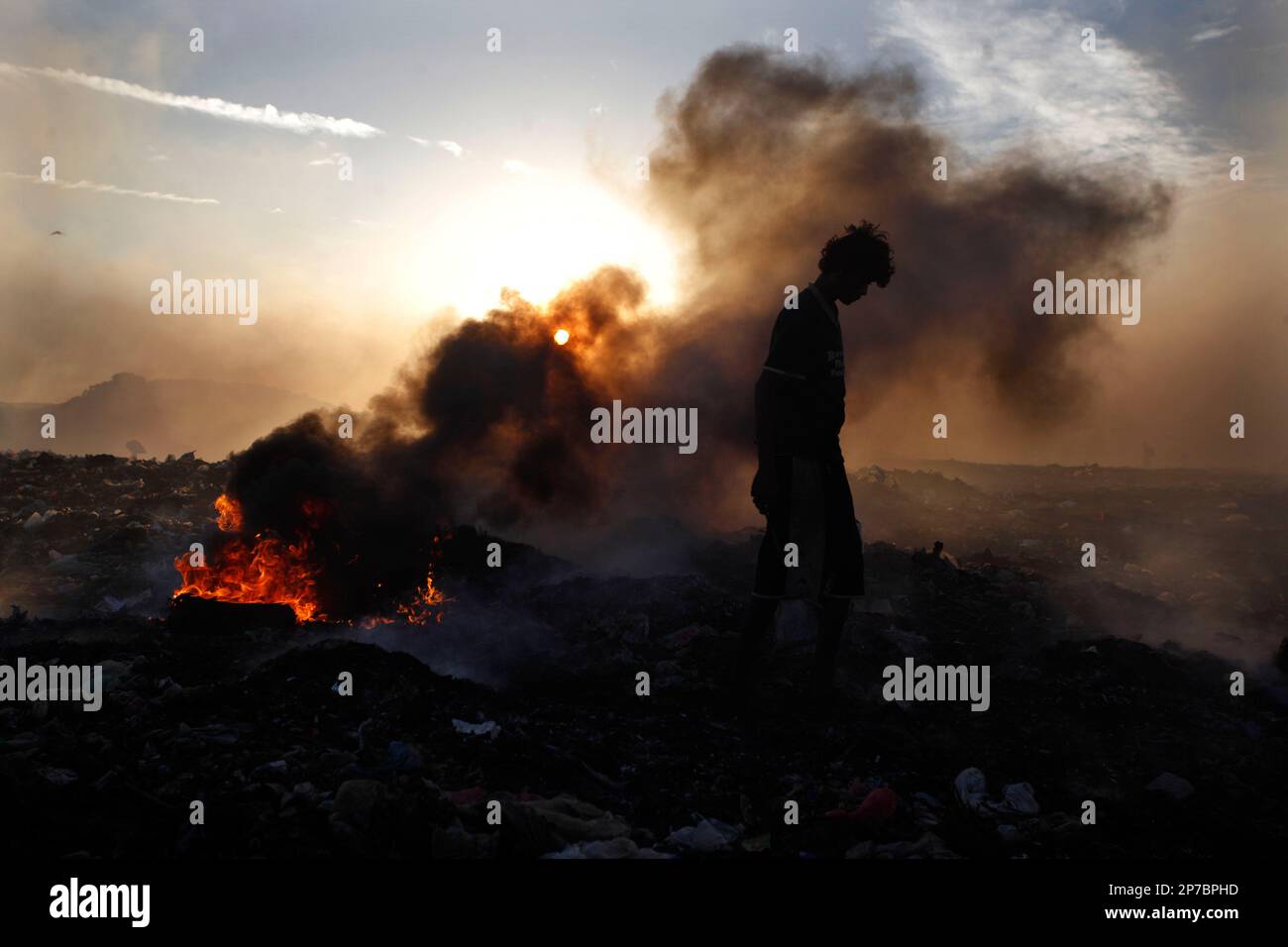 A waste picker searches for recyclable materials at the main landfill in Managua, Nicaragua