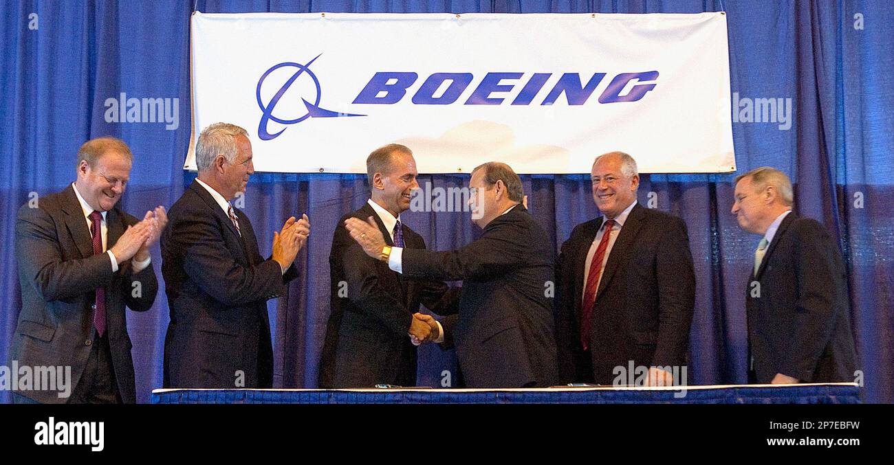 From left: St. Clair County Board Chairman Mark Kern; U.S. Rep. John