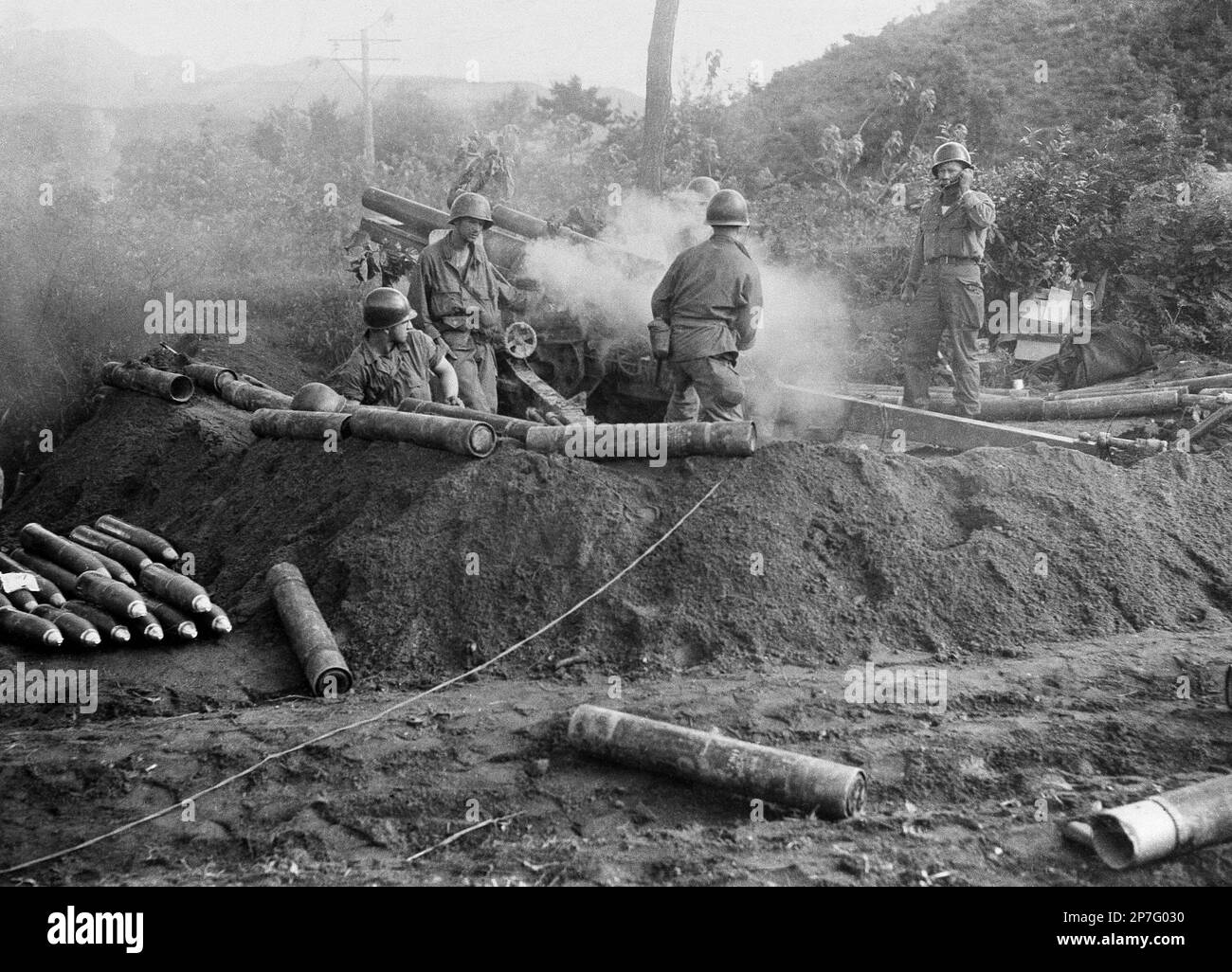 FILE - In this July 10, 1950 file photo, American GIs fire a 105 ...