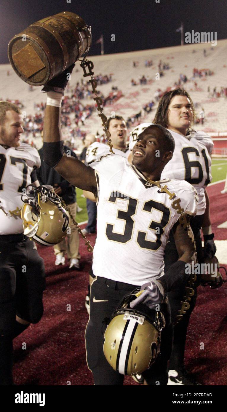 Purdue Running Back Jaycen Taylor (33) Holds The Old Oaken Bucket After ...