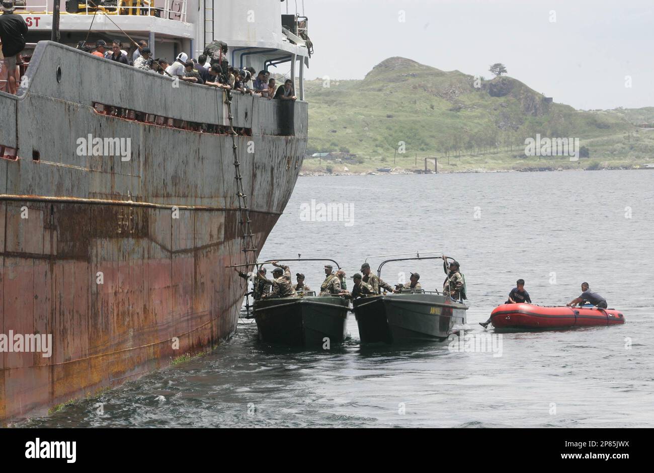 Picture of Philippine Coast Guard and Police Maritime unit prepare to board the ...