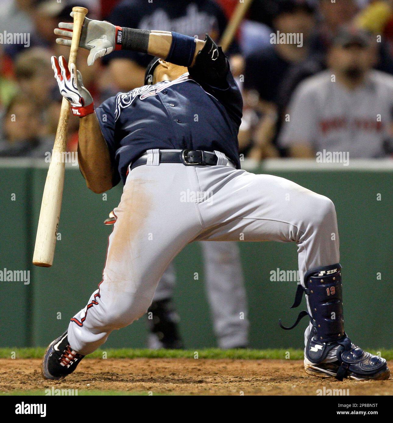 Atlanta Braves' Yunel Escobar hits the deck on a pitch by Boston Red Sox relief pitcher Justin Masterson during the eighth inning of their baseball game at Fenway Park in Boston Friday, June 19, 2009. (AP Photo/Elise Amendola) Stockfoto