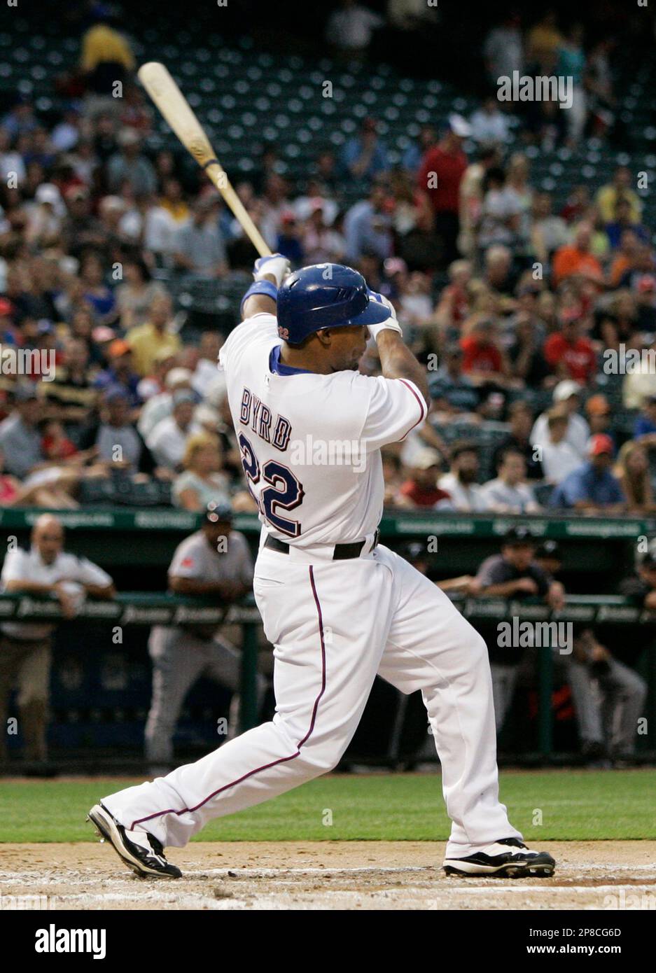 Texas Rangers' Marlon Byrd (22) follows through on a sacrifice fly off of Toronto Blue Jays starting pitcher Ricky Romero that scored Nelson Cruz in the second inning of a baseball game in Arlington, Texas, Thursday, June 11, 2009. The run was the only score in the 1-0 Rangers win. (AP Photo/Tony Gutierrez) Stockfoto