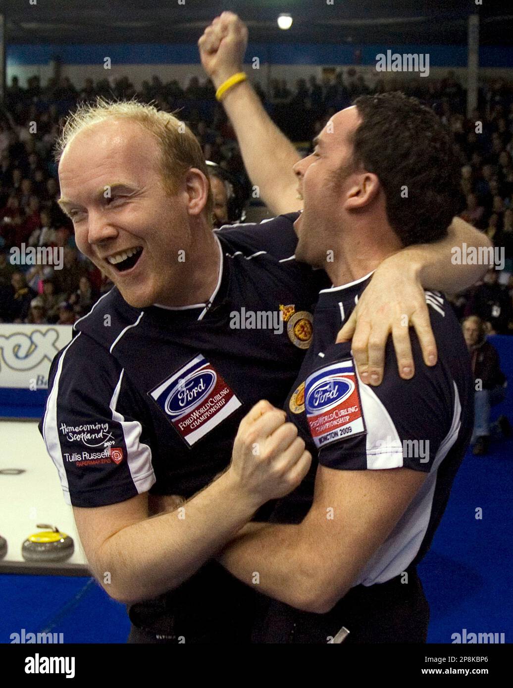 Scotland skip David Murdoch, right, and third Ewan MacDonald celebrate