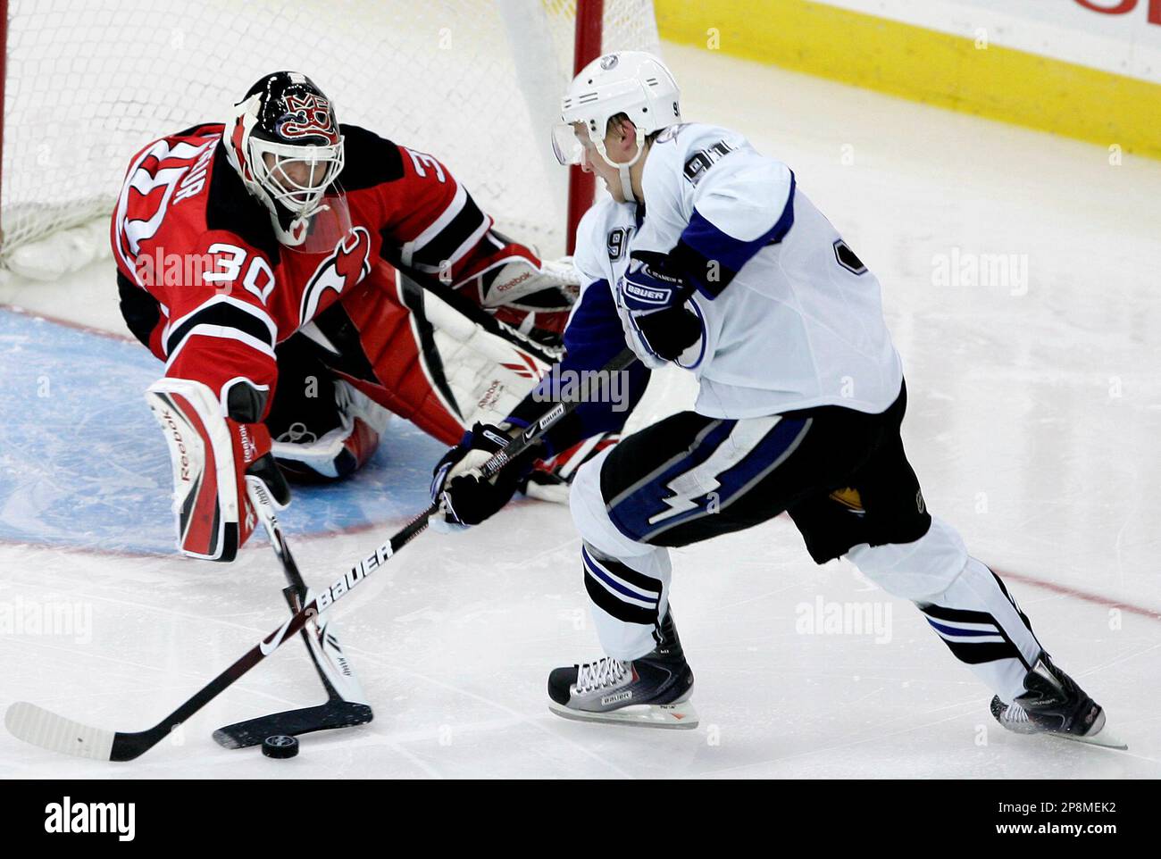 New Jersey Devils' goalie Martin Brodeur (30) makes a poke save on a