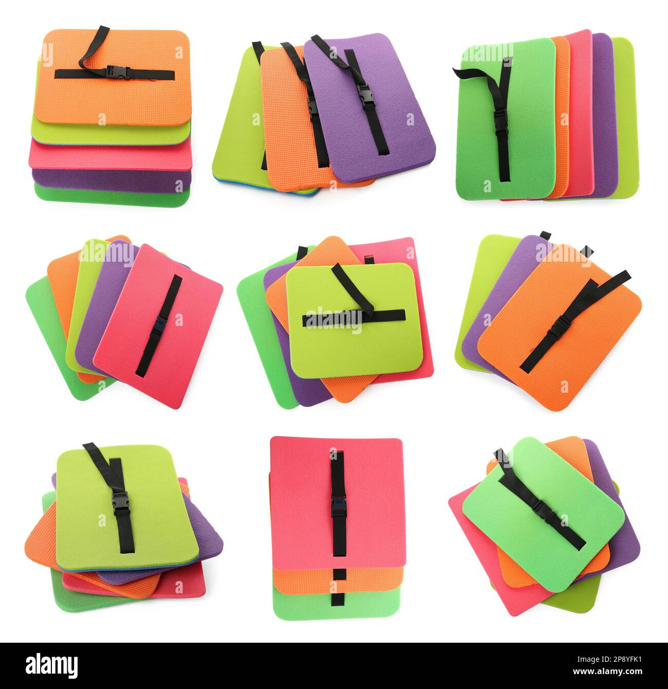 Set mit farbenfrohen Touristenmatten aus Schaumstoff auf weißem Hintergrund Stockfoto