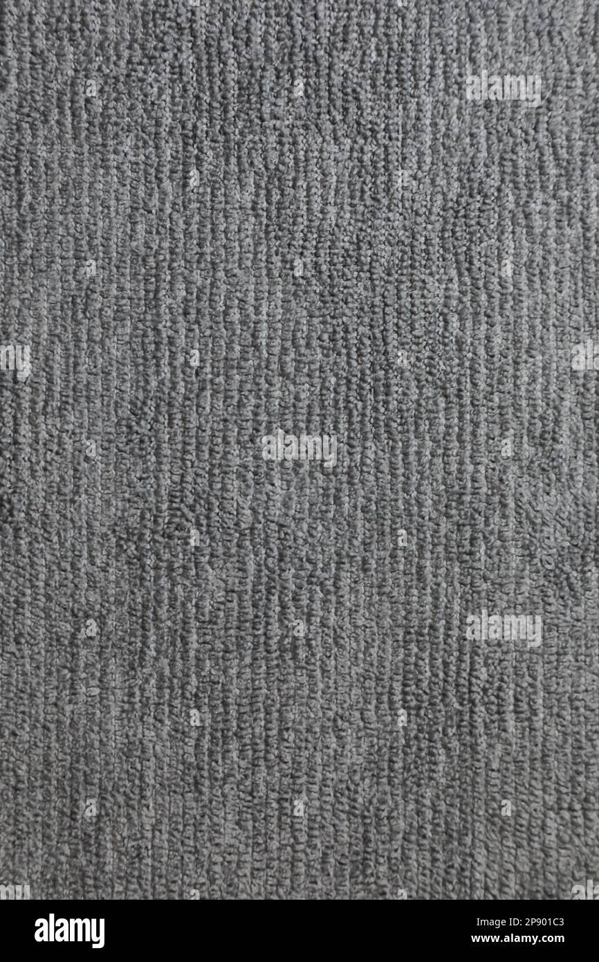 Graue Stoffhintergrundstruktur. Graues Stoffgewebe Textilmaterial. Stockfoto