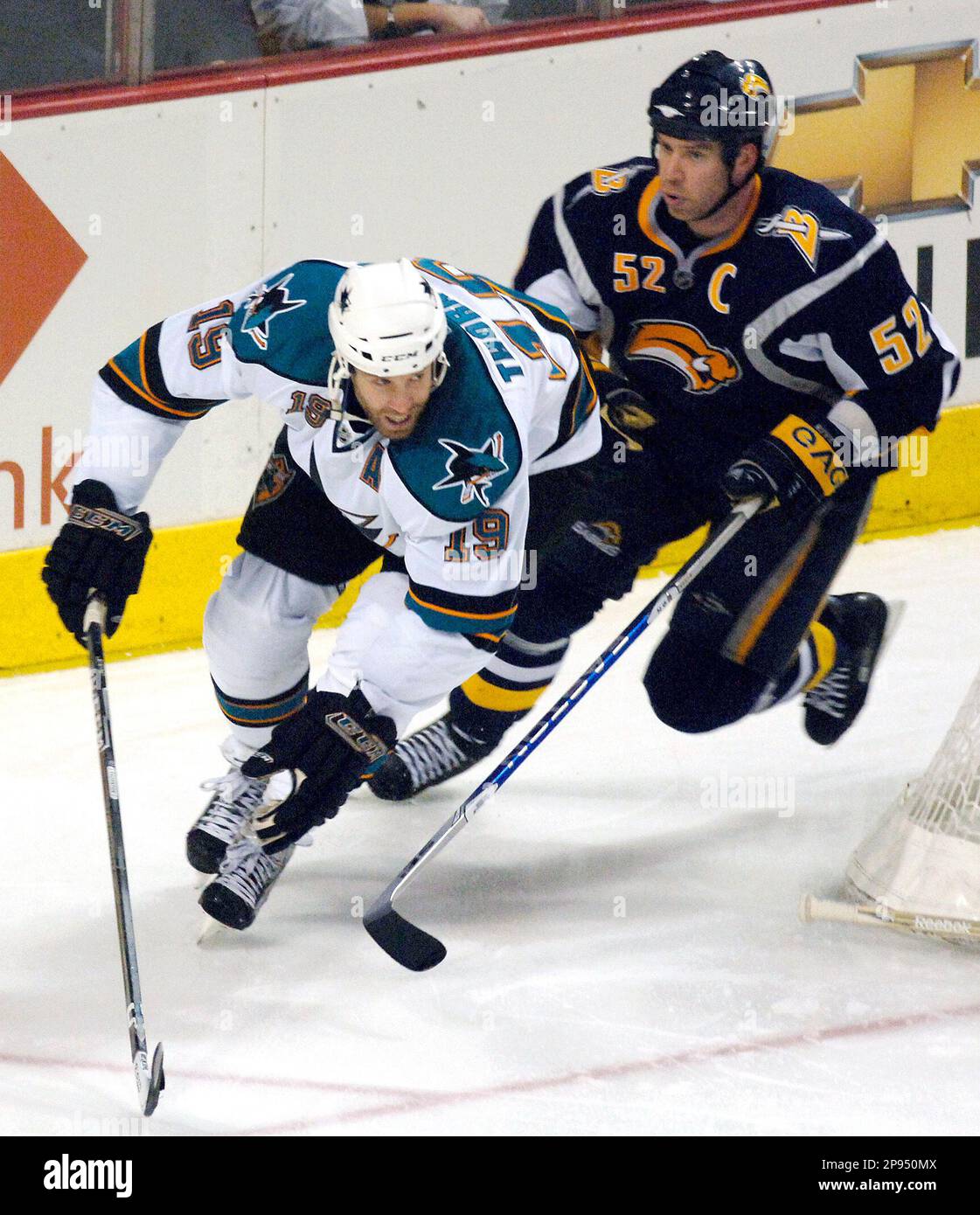 Buffalo Sabres defenseman Craig Rivet, right, skates after San Jose