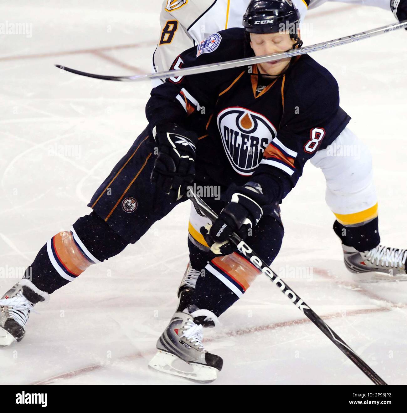 Edmonton Oilers left wing Liam Reddox (85) gets a stick to the face