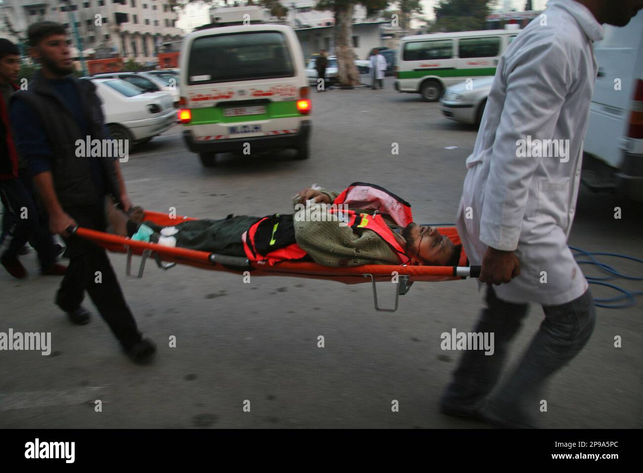 Palestinians Carry A Dead Paramedic Into Shifa Hospital In Gaza City ...