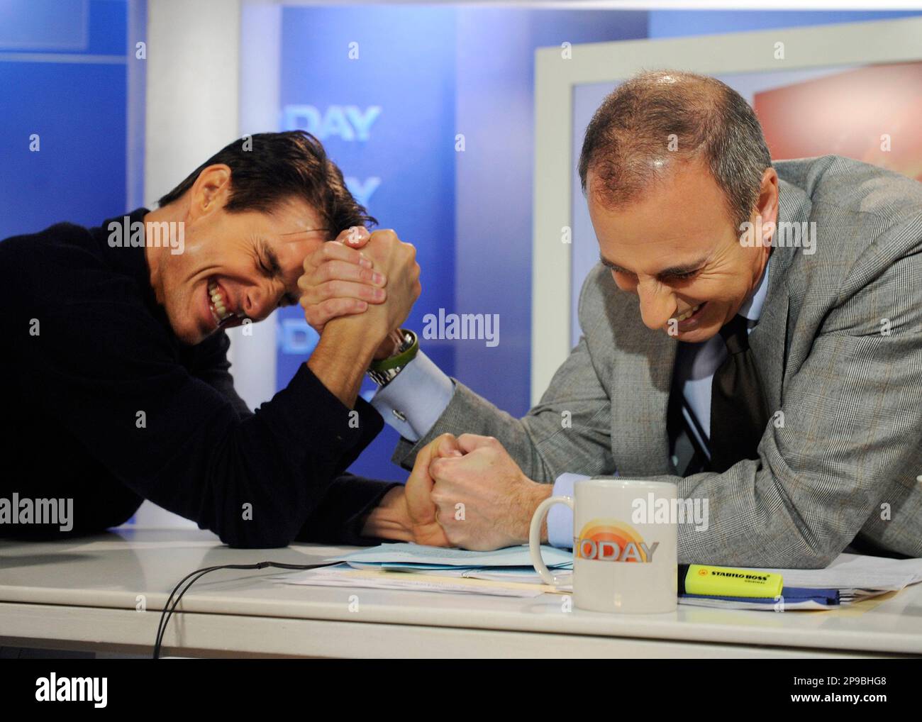 Actor Tom Cruise, left, arm wrestles with NBC "Today" television show