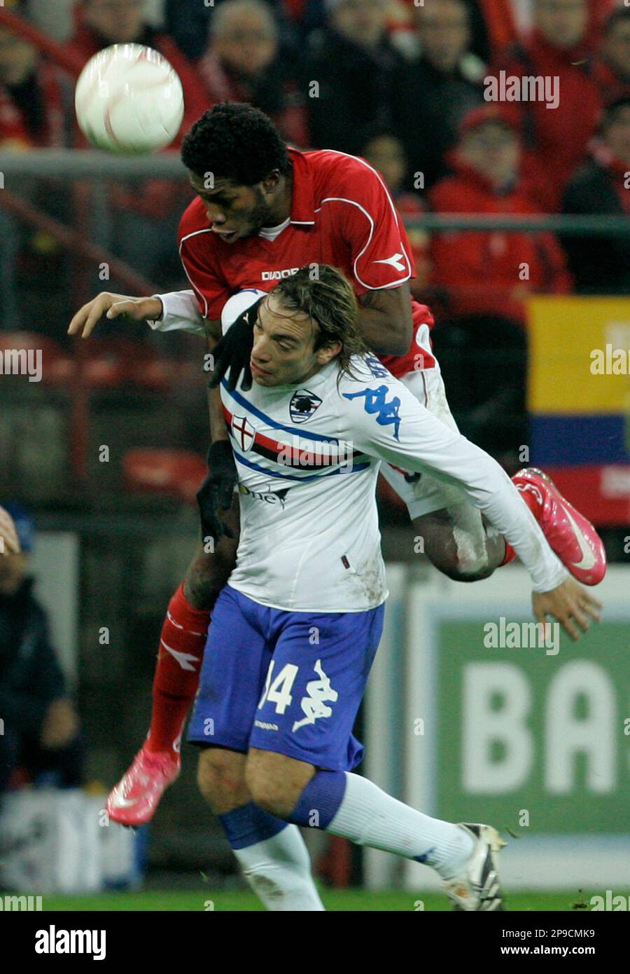 Standard Liege player Dieu Mbokani, on top, challenges Sampdoria's