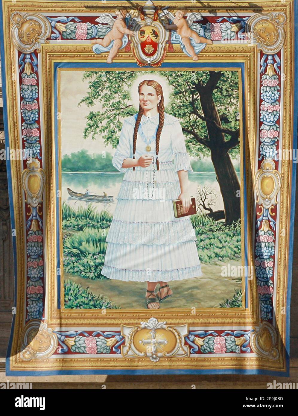 The tapestry depicting Narcisa de Jesus Martillo Moran, a 19th century laywoman from Ecuador who helped the sick and the poor, hangs from St.Peter's Basilica facade during an open-air canonization ceremony in St. Peter square at the Vatican led by Pope Benedict XVI Sunday, Oct. 12, 2008. The pontiff canonized four saints, including India's first woman saint, Sister Alphonsa of the Immaculate Conception. (AP Photo/Alessandra Tarantino) Stockfoto