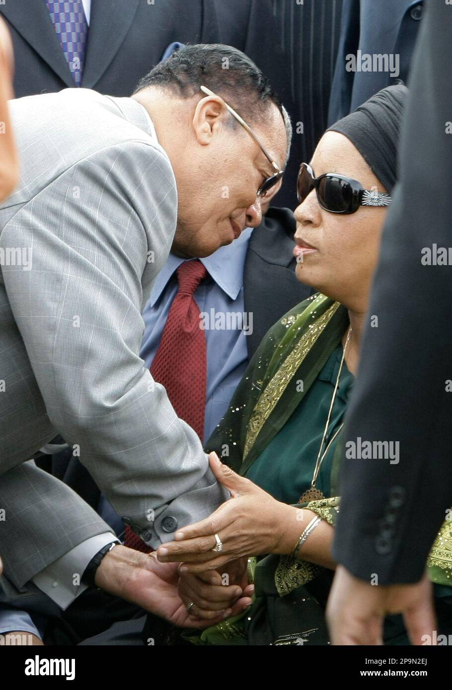 Nation of Islam leader Louis Farrakhan, left, consoles Laila Mohammed
