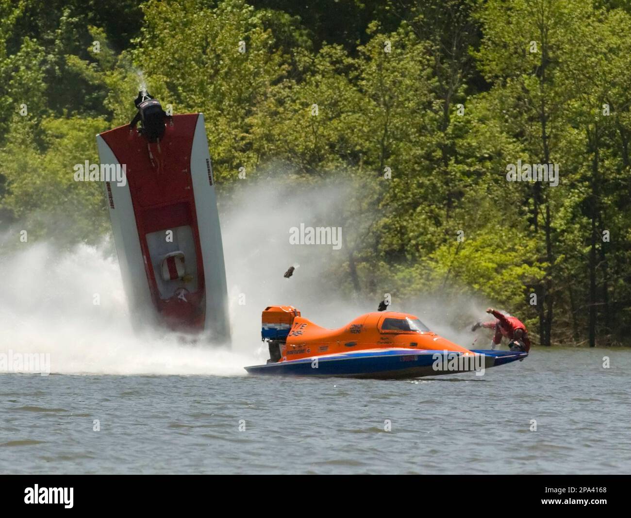 Joe Peroceschi, of Muskego, Wisc., far right, is thrown from his boat