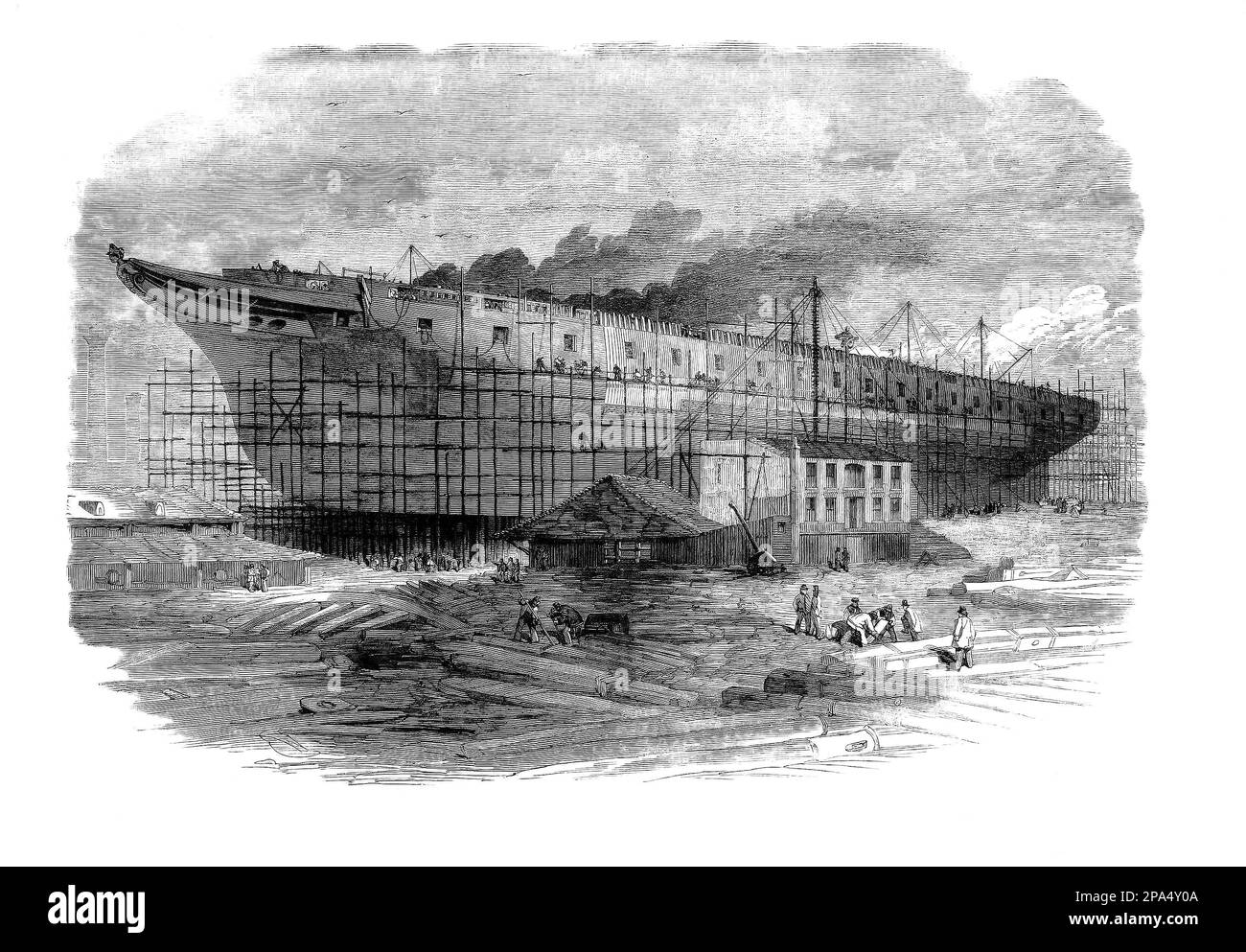 Das Gebäude von HMS Warrior, einer dampfbetriebenen, gepanzerten Fregatte mit 40 Pistolen, die für die Royal Navy von 1859 bis 1861 im Thames Ironworks in Blackwall, London, England, gebaut wurde. Krieger und ihr Schwesterschiff HMS Black Prince waren die ersten gepanzerten, eisernen Kriegsschiffe und wurden als Reaktion auf Frankreichs Start des ersten meeresbetriebenen, eisernen Kriegsschiffs Gloire im Jahr 1859 gebaut. Stockfoto