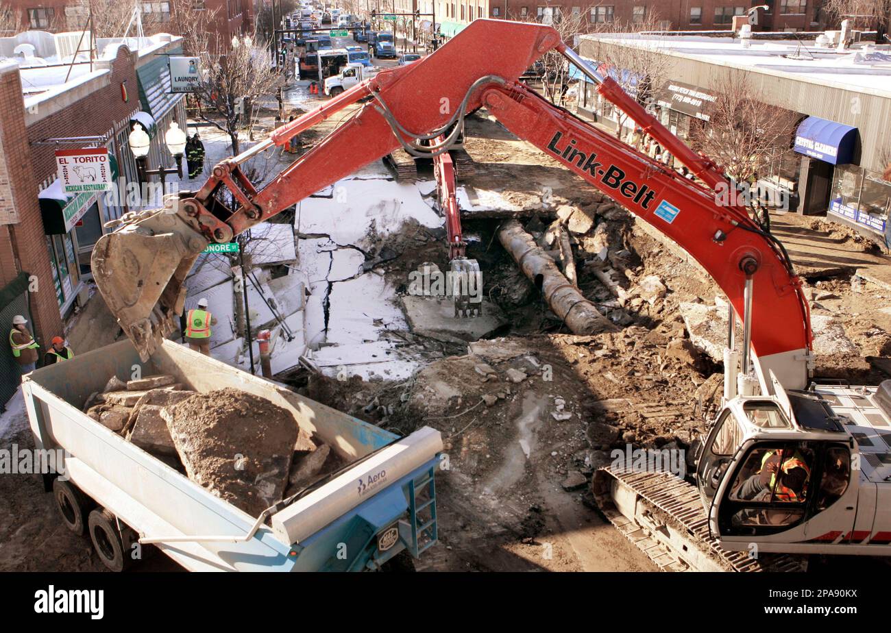 ** FILE ** Construction crews work to repair a 36 inch water main break ...