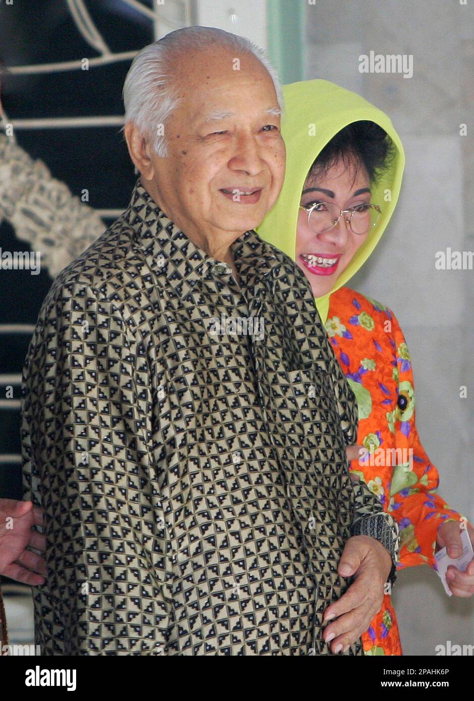 ** FILE ** Former Indonesian President Suharto, left, walks with his ...