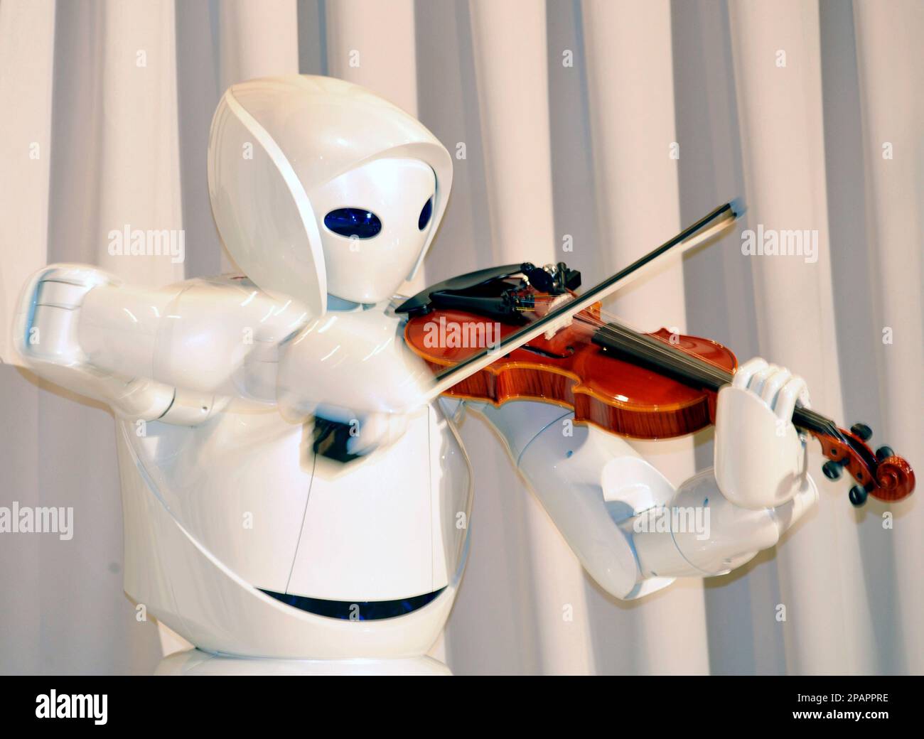 Toyota Motor Corp.'s new violin robot performs during a press unveiling
