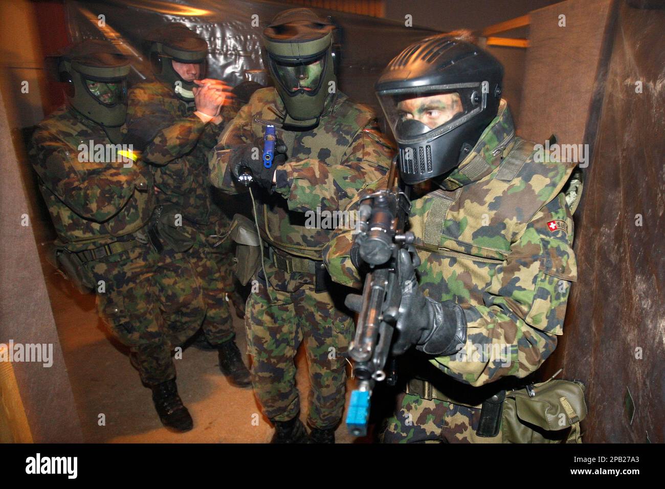 Swiss army soldiers try to extract a hostage during the 17th Swiss Raid Commando in Biere Switzerland Saturday September 29 2007. The Swiss Raid Commando is the world s biggest and most important
