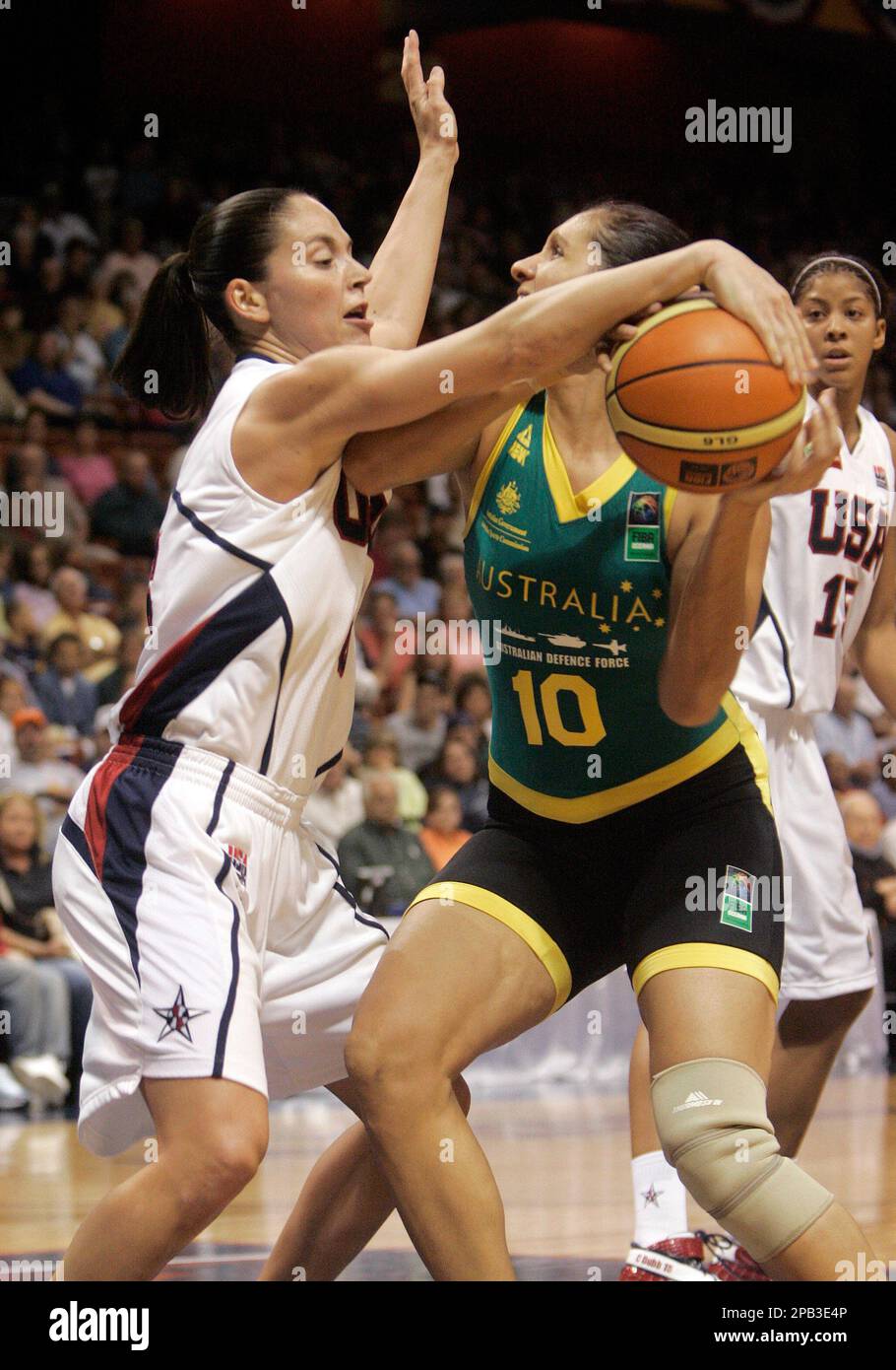 USA's Sue Bird, left, knocks the ball away from Australia's Rohanee Cox