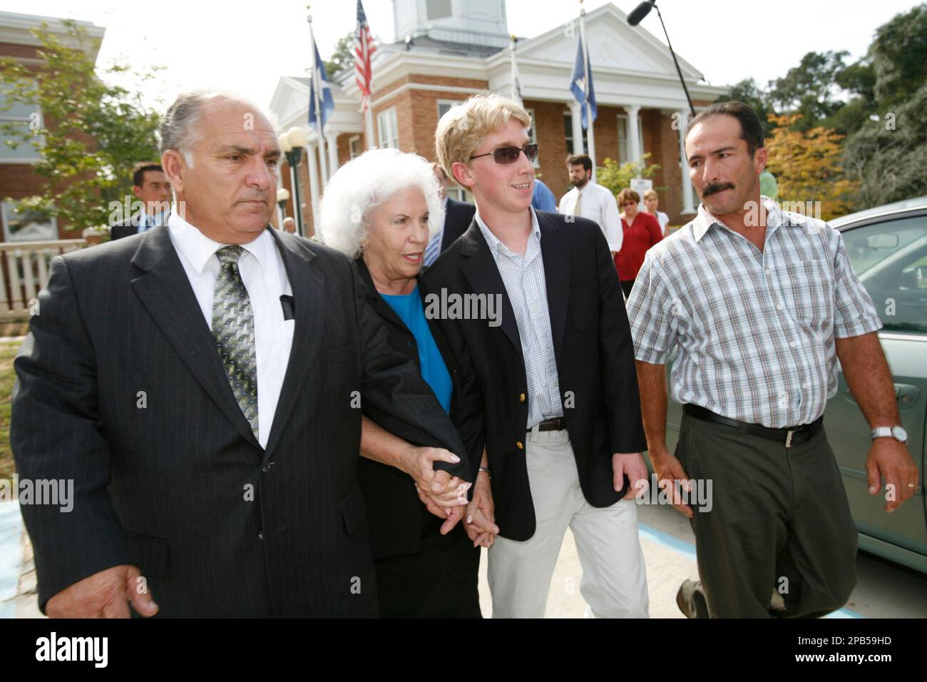 Salvador, 67, left, and Mabel Mangano, 64, second left, owners of St