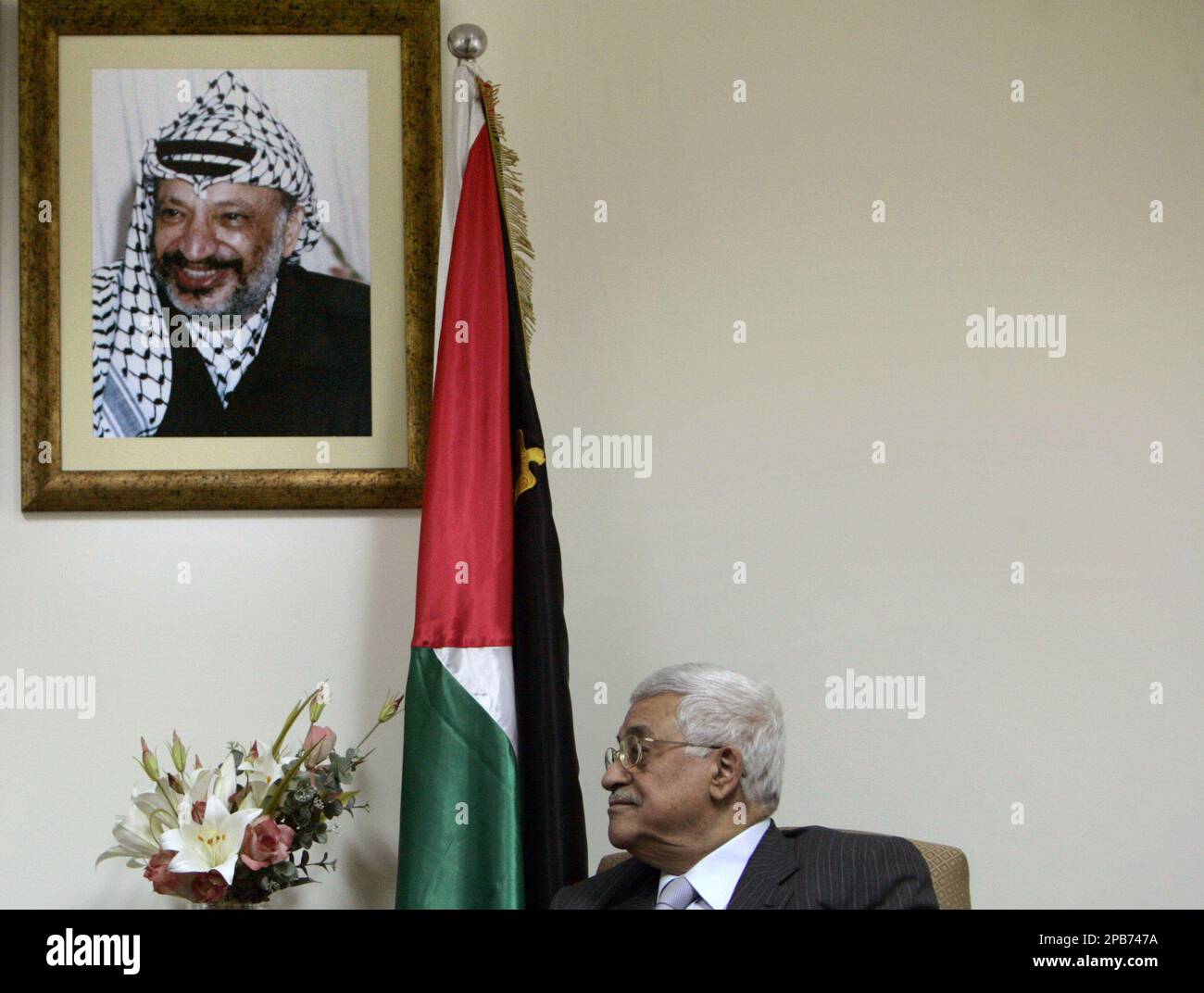 Under a portrait of late Palestinian leader Yasser Arafat, Palestinian ...