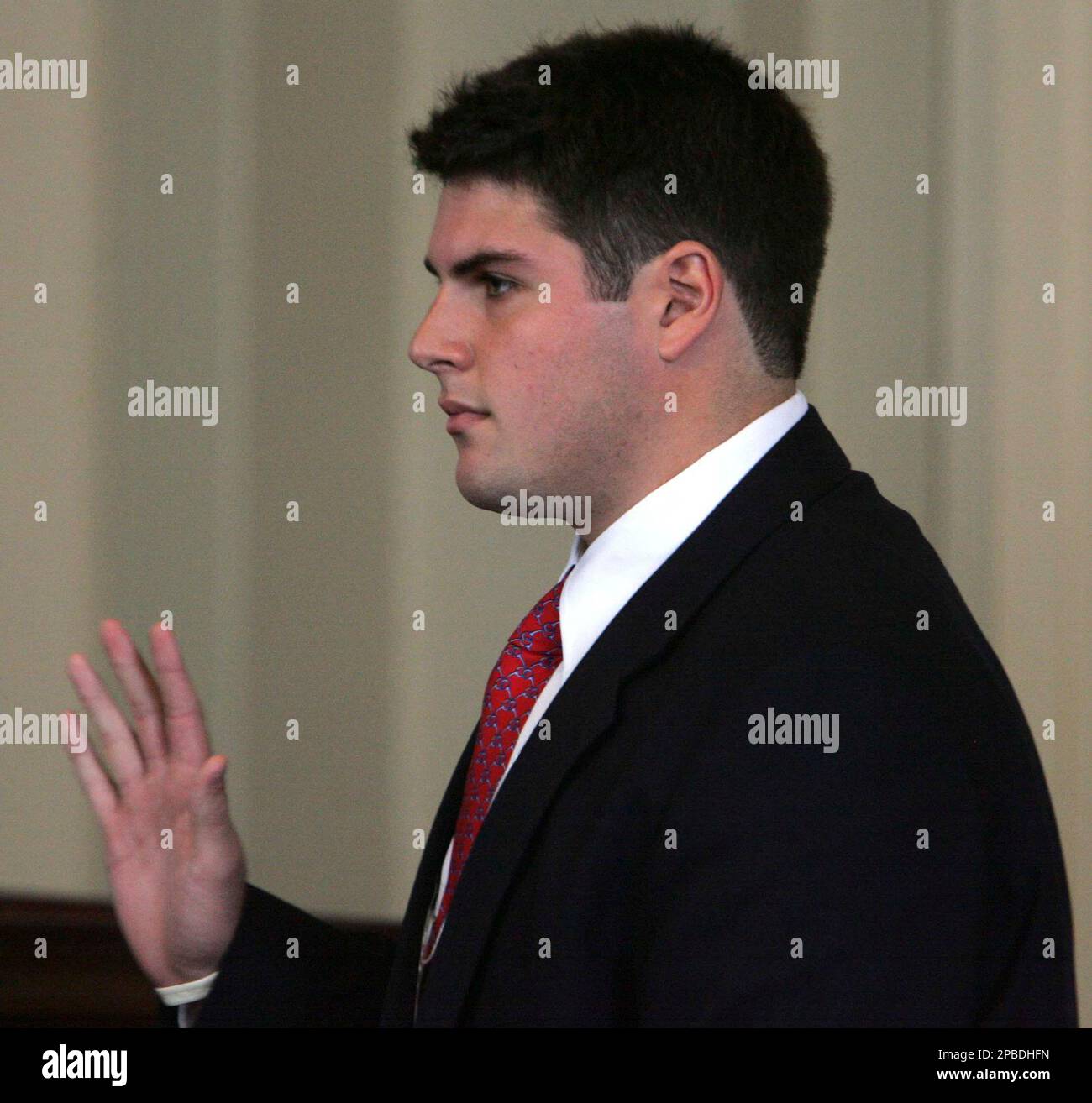 Former Duke lacrosse player Reade Seligmann is sworn in before