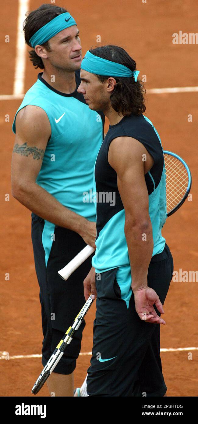 Spain's Rafael Nadal, right, and Carlos Moya pause during their double  match against Switzerland's Roger Federer and Stanislas Wawrinka in the  Rome Masters tennis tournament at Rome's Foro Italico clay-court, Monday,  May
