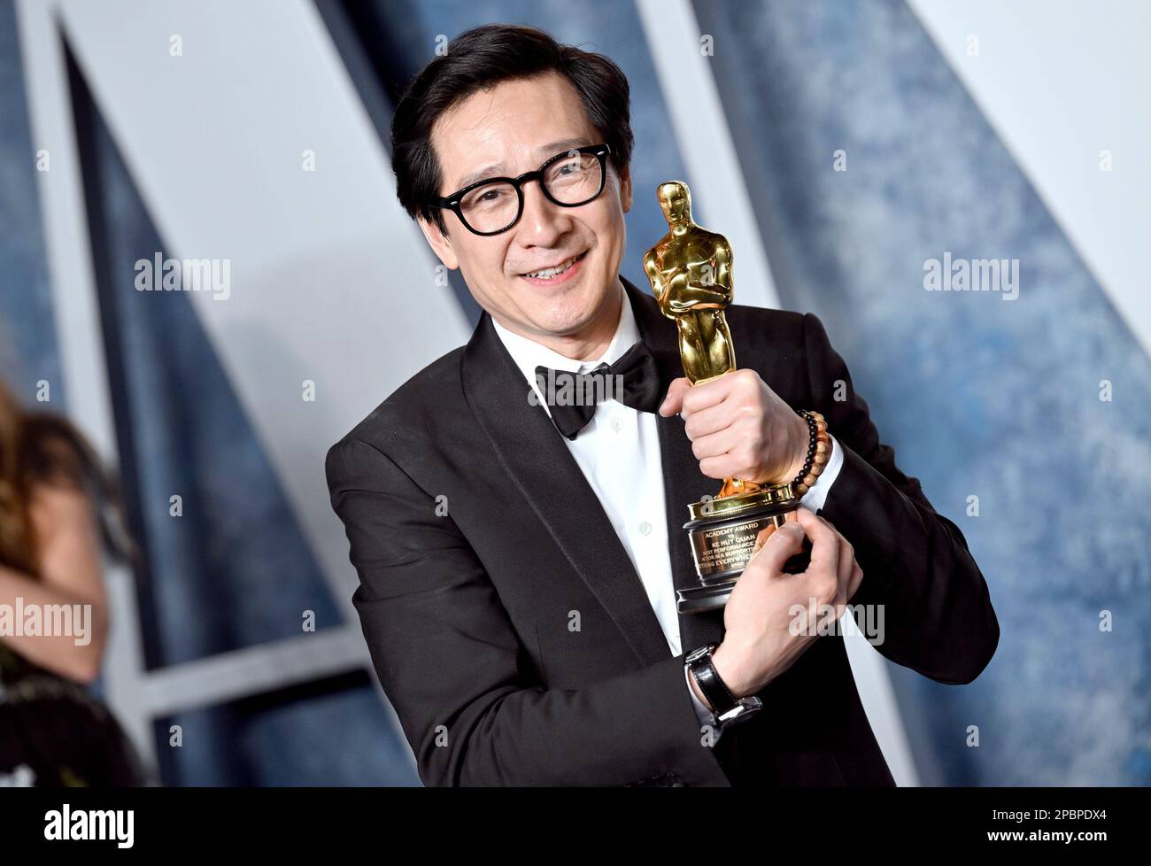 Ke Huy Quan, winner of the best supporting actor award, arrives at the