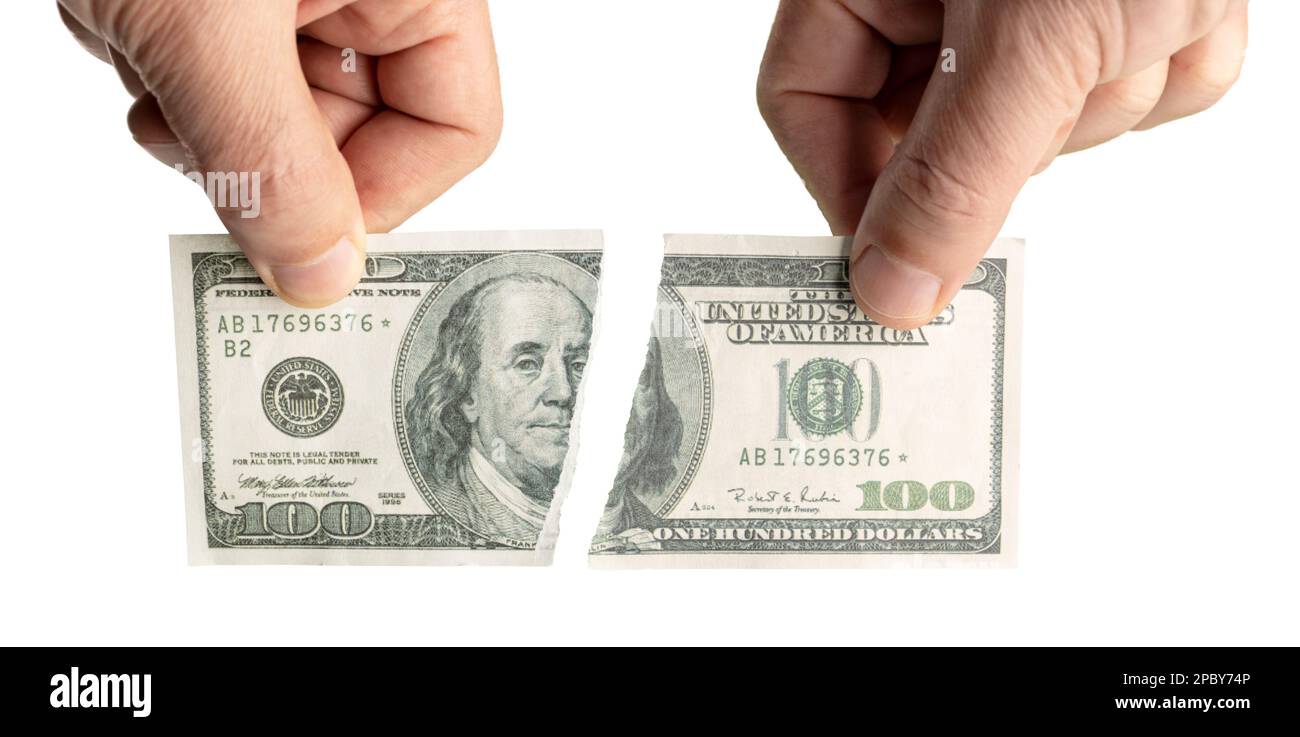 Handgehaltene zerrissene Dollarbanknote isoliert auf weißem Hintergrund Stockfoto