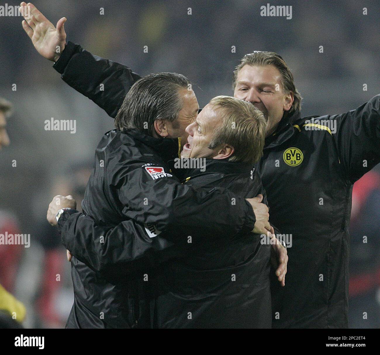 Dortmund's head coach Juergen Roeber, in front, celebrates winning the
