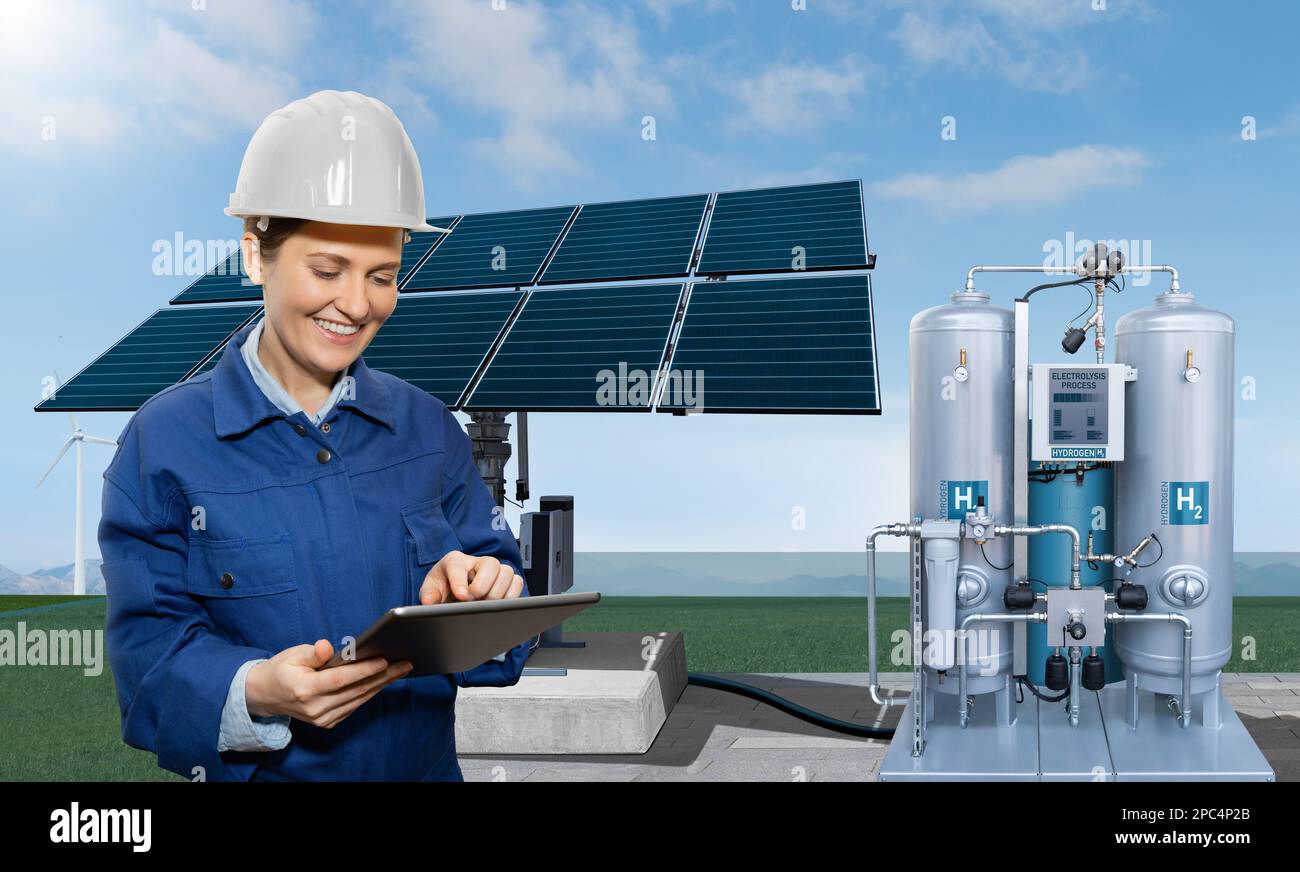 Ingenieurin mit Tablet-Computer im Hintergrund der Wasserstofffabrik Stockfoto