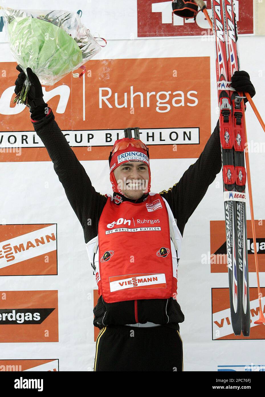 Germany's Michael Greis celebrates on the podium after winning the men's 10 km sprint biathlon World Cup race, on Thursday, Dec. 14, 2006, in Hochfilzen, Austria. (AP Photo/Kerstin Joensson) Stockfoto