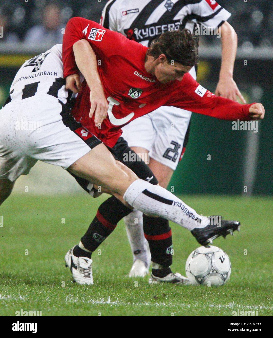 Moenchengladbach's Thomas Helveg, left, from Denmark challenges Hanover ...