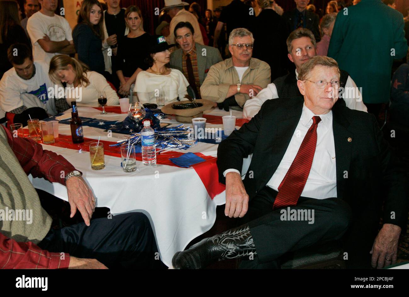 Sen. Conrad Burns, RMont., right, watches returns at a victory party