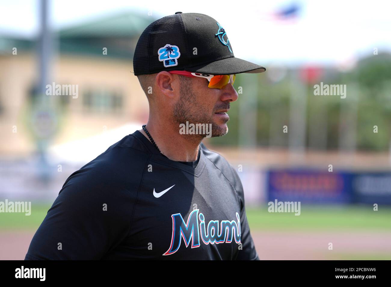 Miami Marlins manager Skip Schumaker walks on the field before a spring