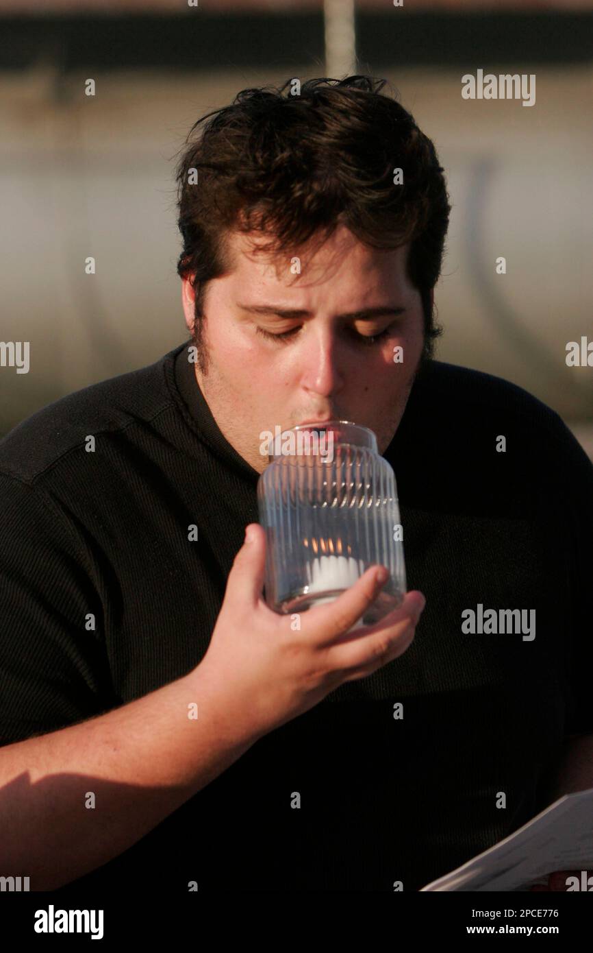 Death penalty opponent Ian Brownhill, of England, blows out a candle