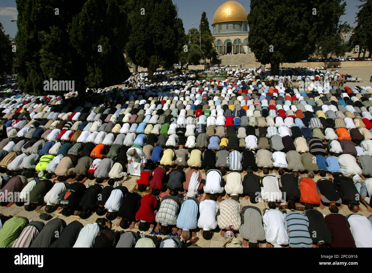 Backdropped by the Dome of the Rock Mosque, thousands of Palestinian ...