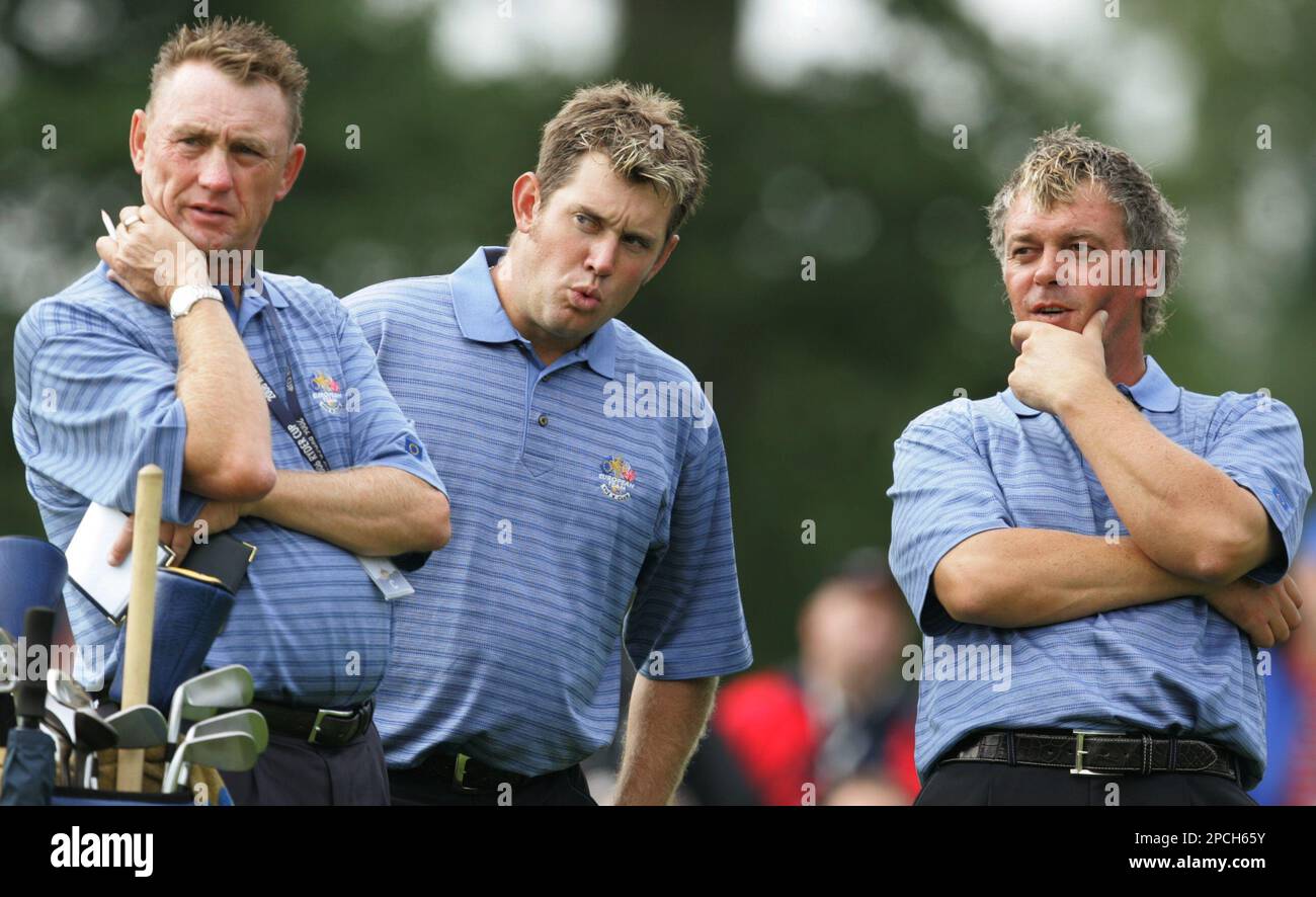 European Ryder Cup team players Darren Clarke, right, Lee Westwood. centre, and Westwood's caddie John Graham watch their playing partners play a shot during a practice round at the K Club golf course, Straffan, Ireland, Thursday Sept. 21, 2006. The 36th Ryder Cup, is scheduled to get underway on Friday . (AP Photo/Alastair Grant) ** EDITORIAL USE ONLY ** Stockfoto