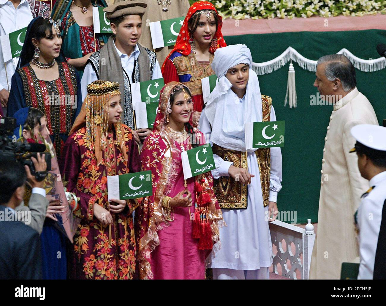 Pakistans Prime Minister Shaukat Aziz, right, talks to children during ...