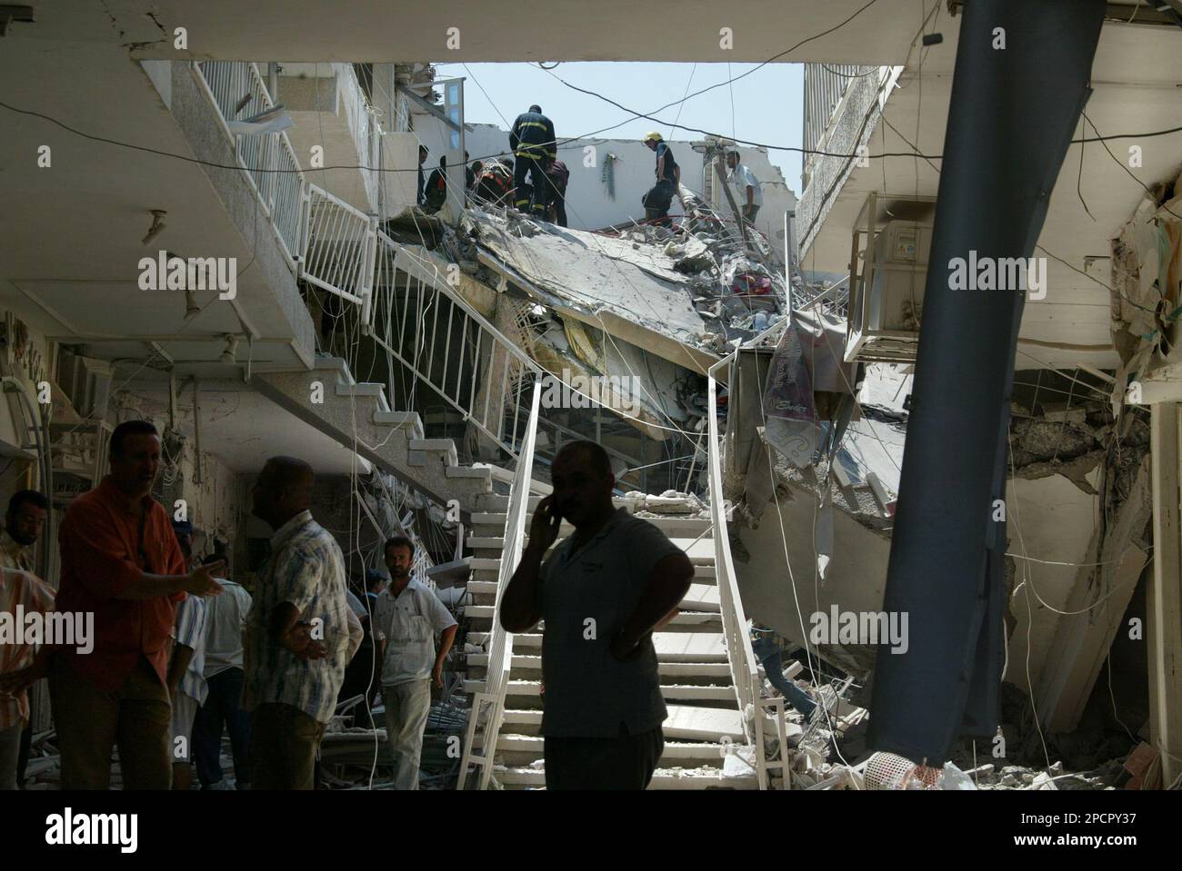 Khalid Rokett A resident makes a phone call from his apartment building that was ...