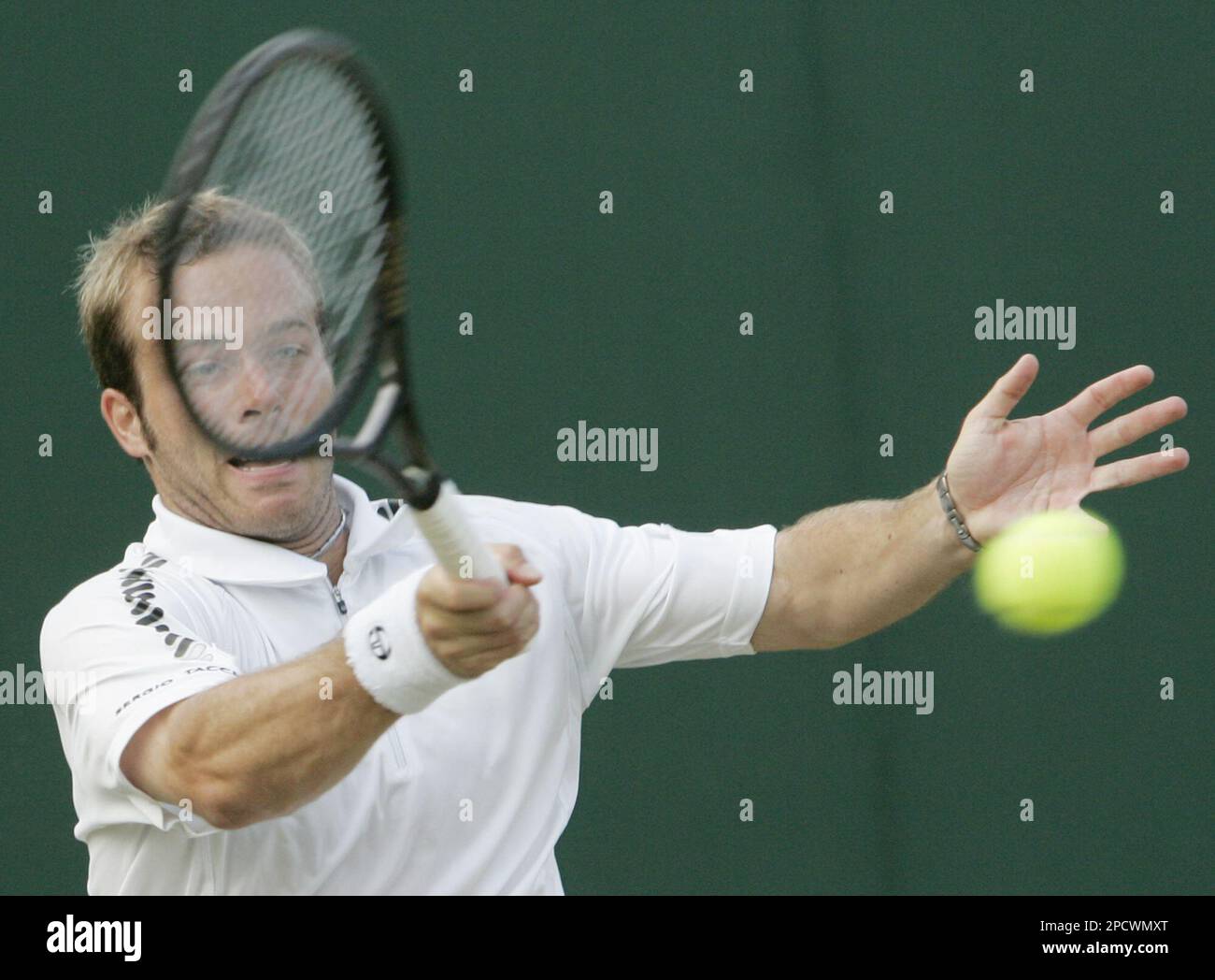 Belgium's Olivier Rochus returns a shot from Tomas Zib of the Czech Republic, duringt their Men's Singles, second round, match at Wimbledon, Thursday June 29, 2006.(AP Photo/Kirsty Wigglesworth) Stockfoto
