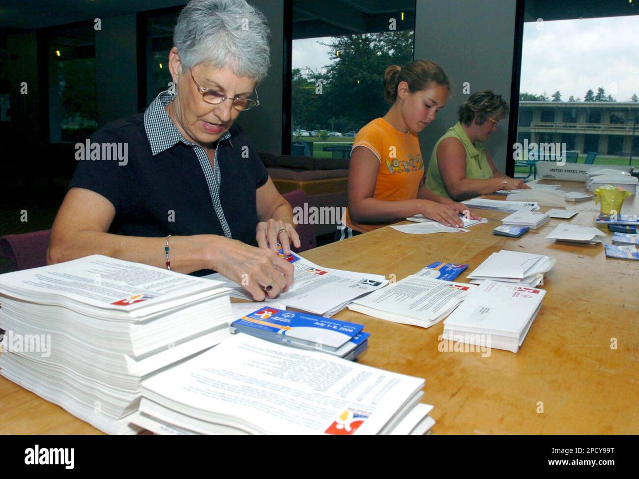 Special Olympics volunteers Meredith Marrs, 12, center, and her