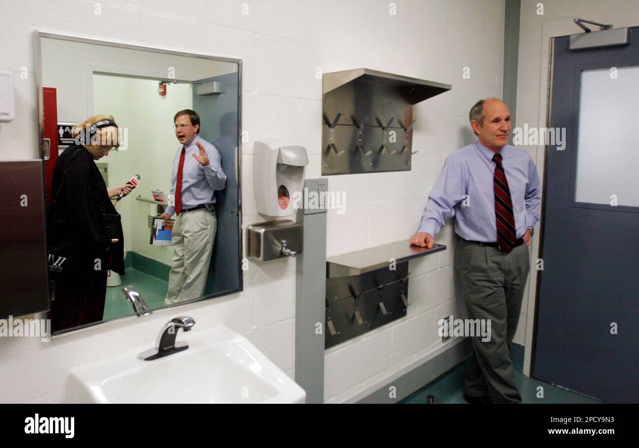 Dr. Tru Twedt, center, Director of Biosafety at the University of gives visitors a tour