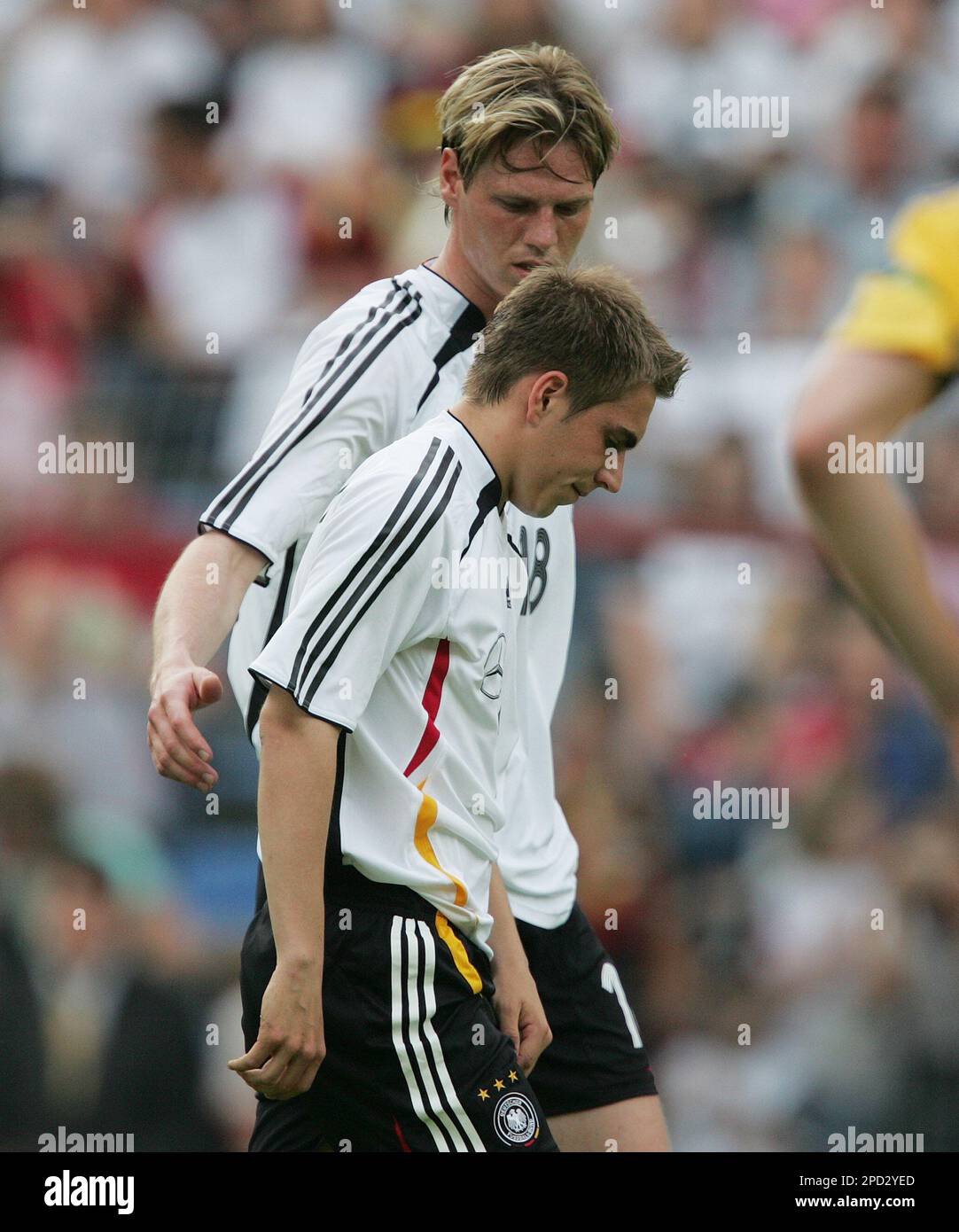 Germany's Philipp Lahm, in front, is seen with Tim Borowski after he