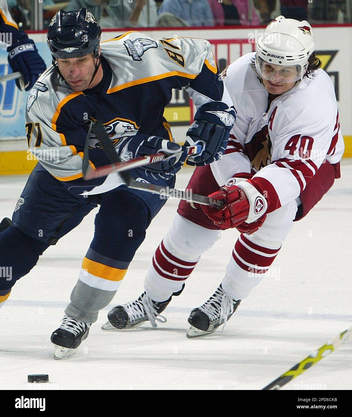 Phoenix Coyotes center Mike Ricci (40) lifts the stick of Nashville