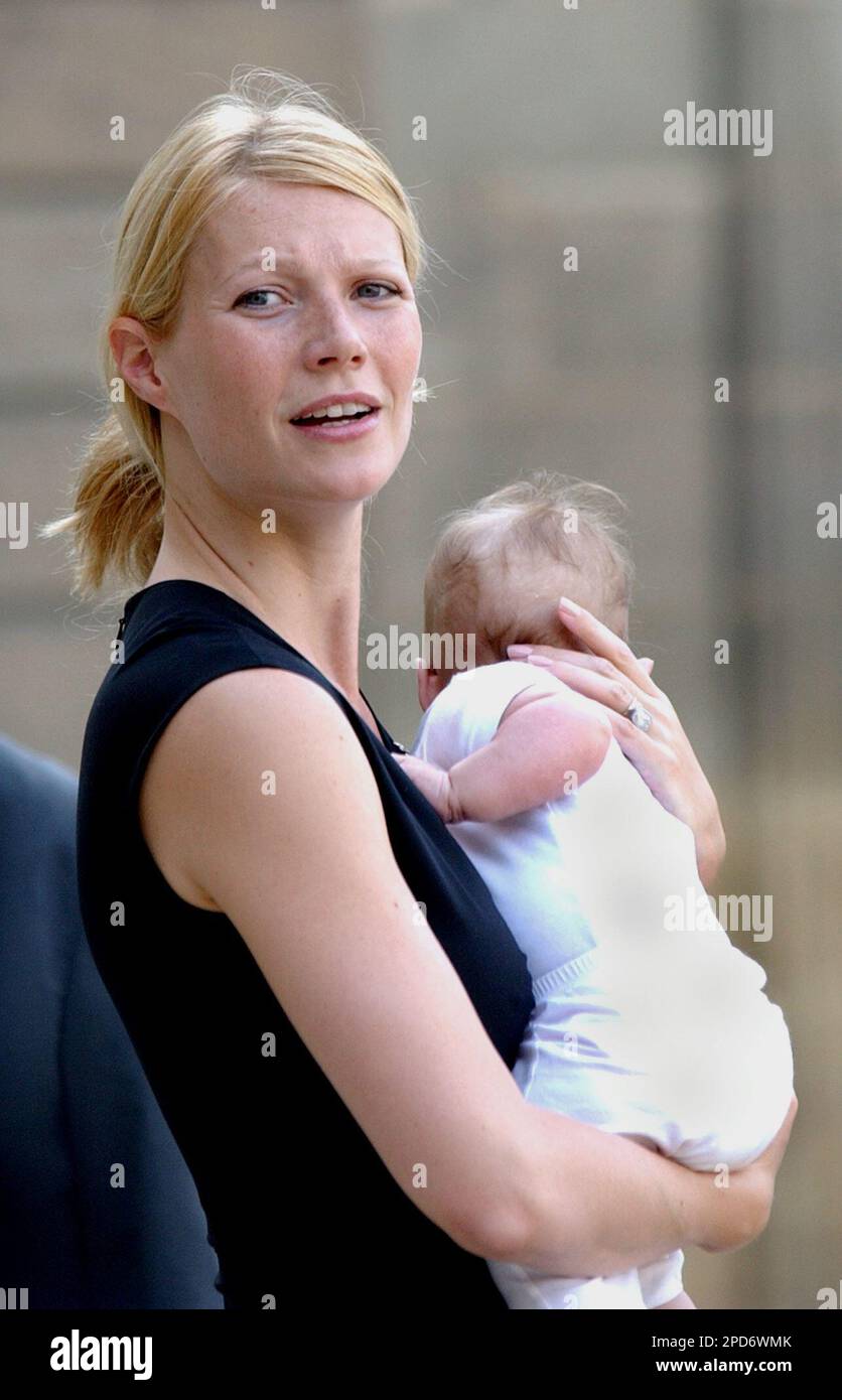 Paltrow holds her baby, Apple, upon her arrival at the Elysee