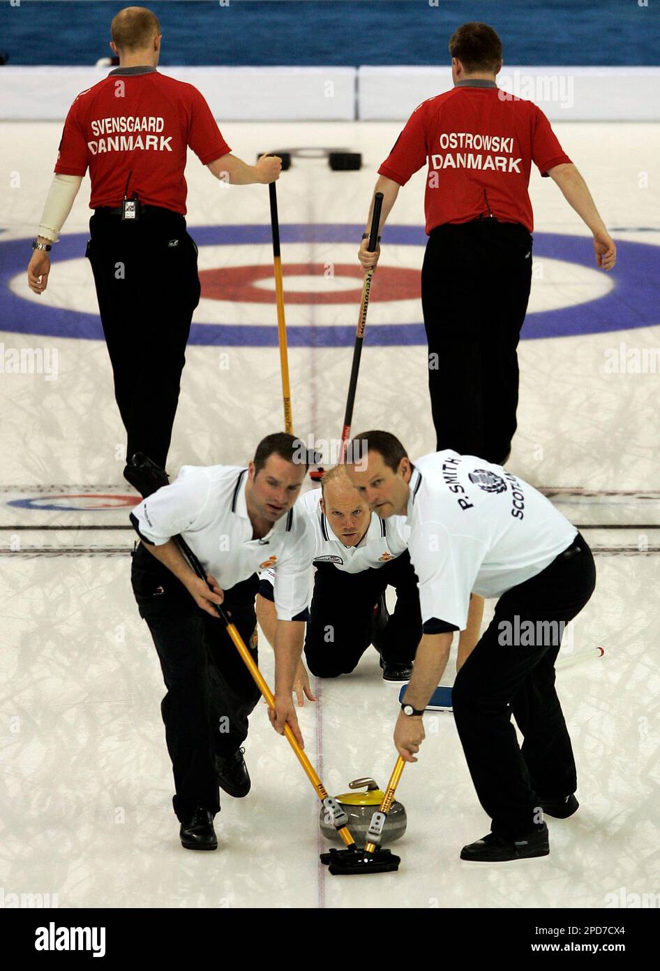 Scotland's Euan Byers, left, and Peter Smith, right, sweep after Evan
